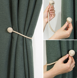 Hooked curtain strap magnets